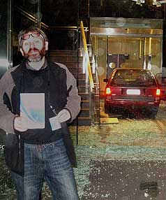 DRIVE-IN: David Theobald poses for a self-portrait of himself with his car "parked'' inside IRD's Christchurch office. 